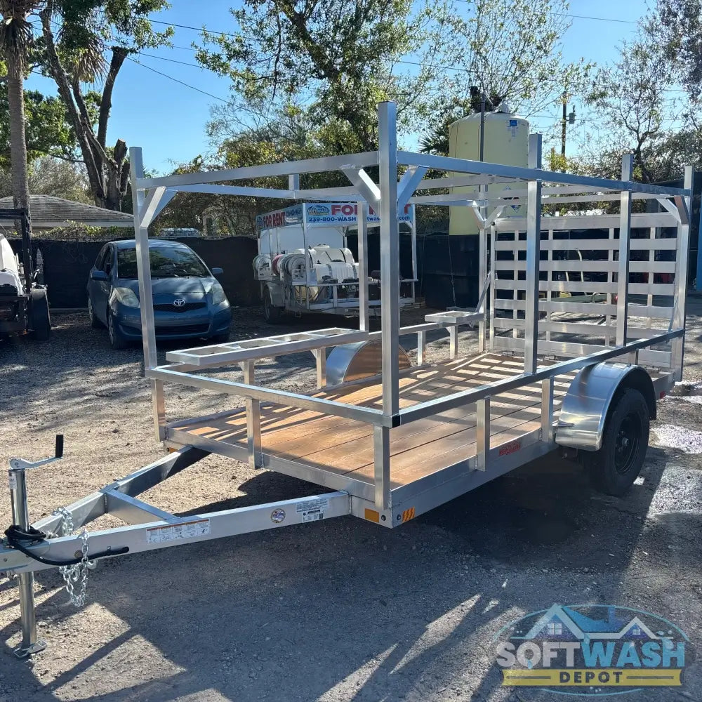 2026 Alcom 6x12 single axle aluminum trailer with rear drop-down tailgate and pressure-treated wood floor, designed for contractor and soft wash equipment setups. - Soft Wash Depot