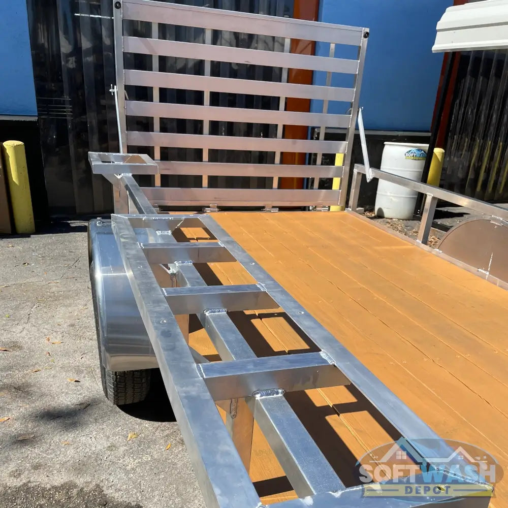2026 Alcom 6x12 single axle aluminum trailer with rear drop-down tailgate and pressure-treated wood floor, designed for contractor and soft wash equipment setups. - Soft Wash Depot