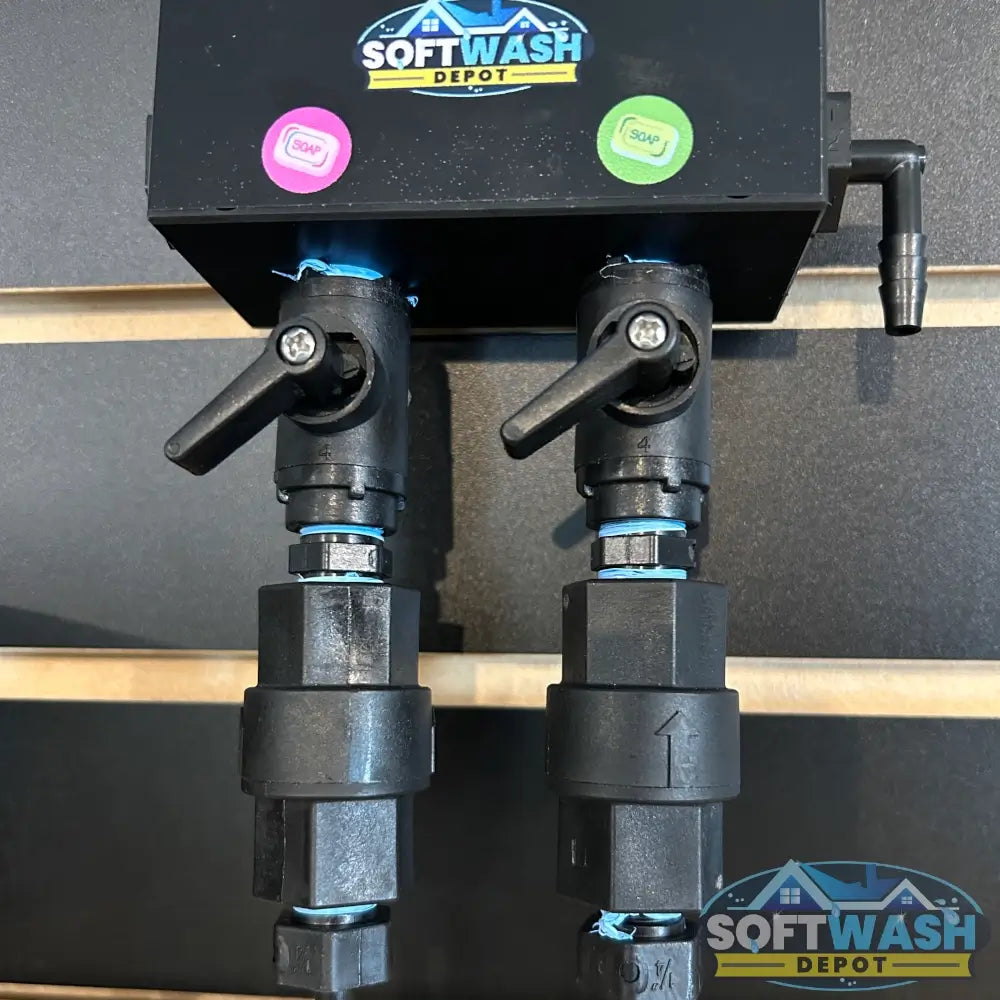 Black downstream injector manifold block available in 2-port and 3-port configurations, featuring chemical-resistant valves and barbed fittings for quick soft wash solution switching. - Soft Wash Depot