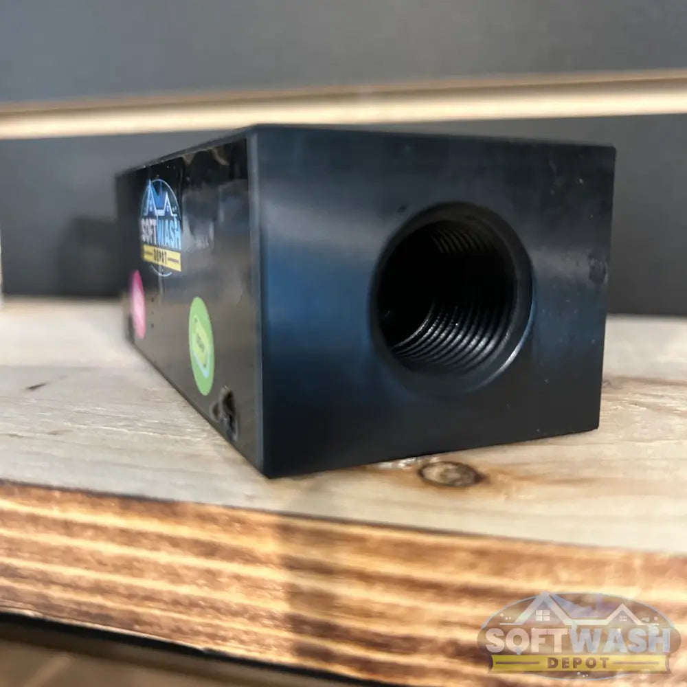 Black downstream injector manifold block available in 2-port and 3-port configurations, featuring chemical-resistant valves and barbed fittings for quick soft wash solution switching. - Soft Wash Depot