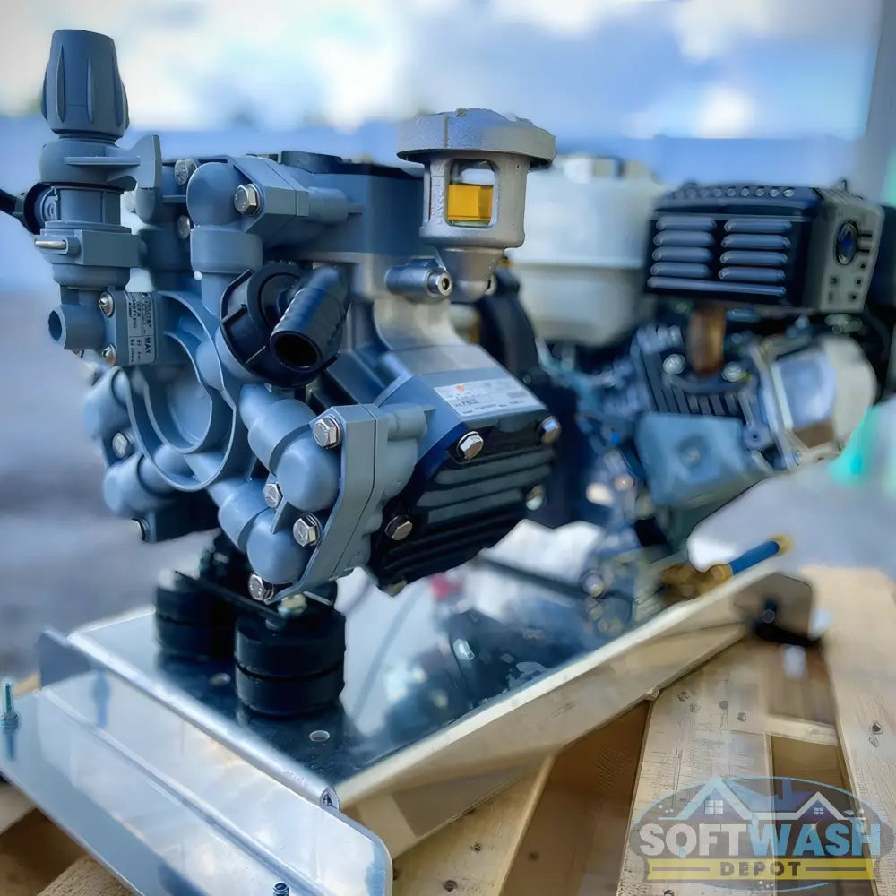 Honda engine with Comet P40 softwash pump system mounted on aluminum base, featuring battery cables and chemical-resistant components - Soft Wash Depot.