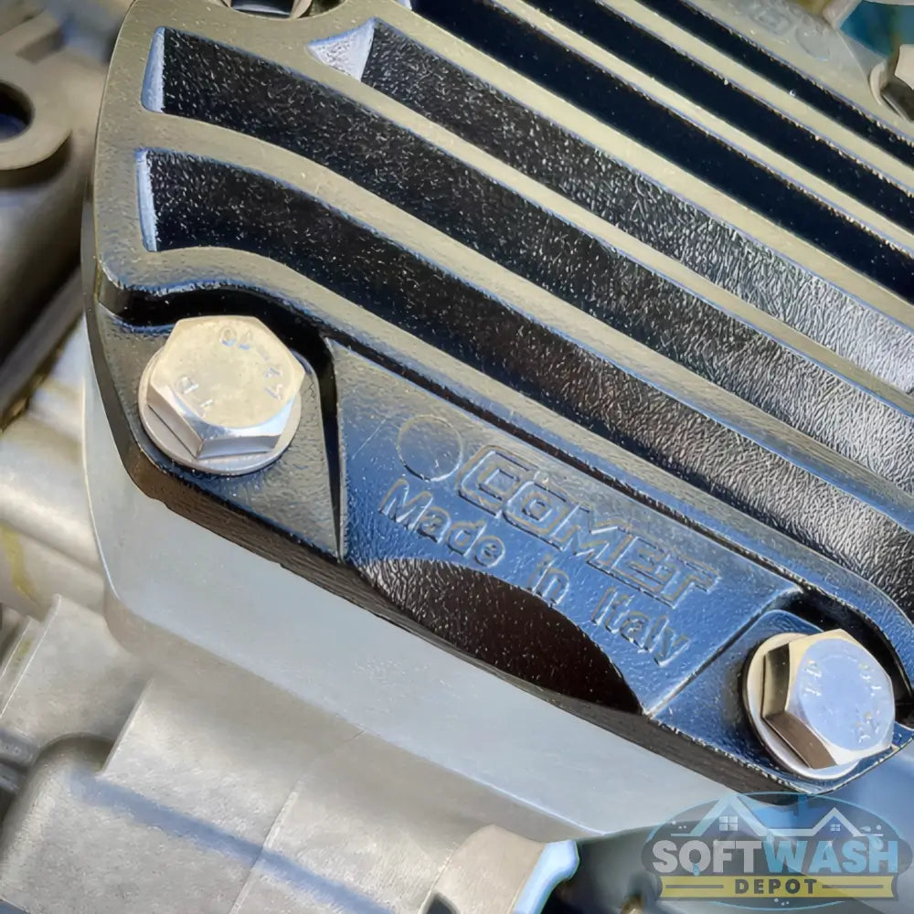 Honda engine with Comet P40 softwash pump system mounted on aluminum base, featuring battery cables and chemical-resistant components - Soft Wash Depot.