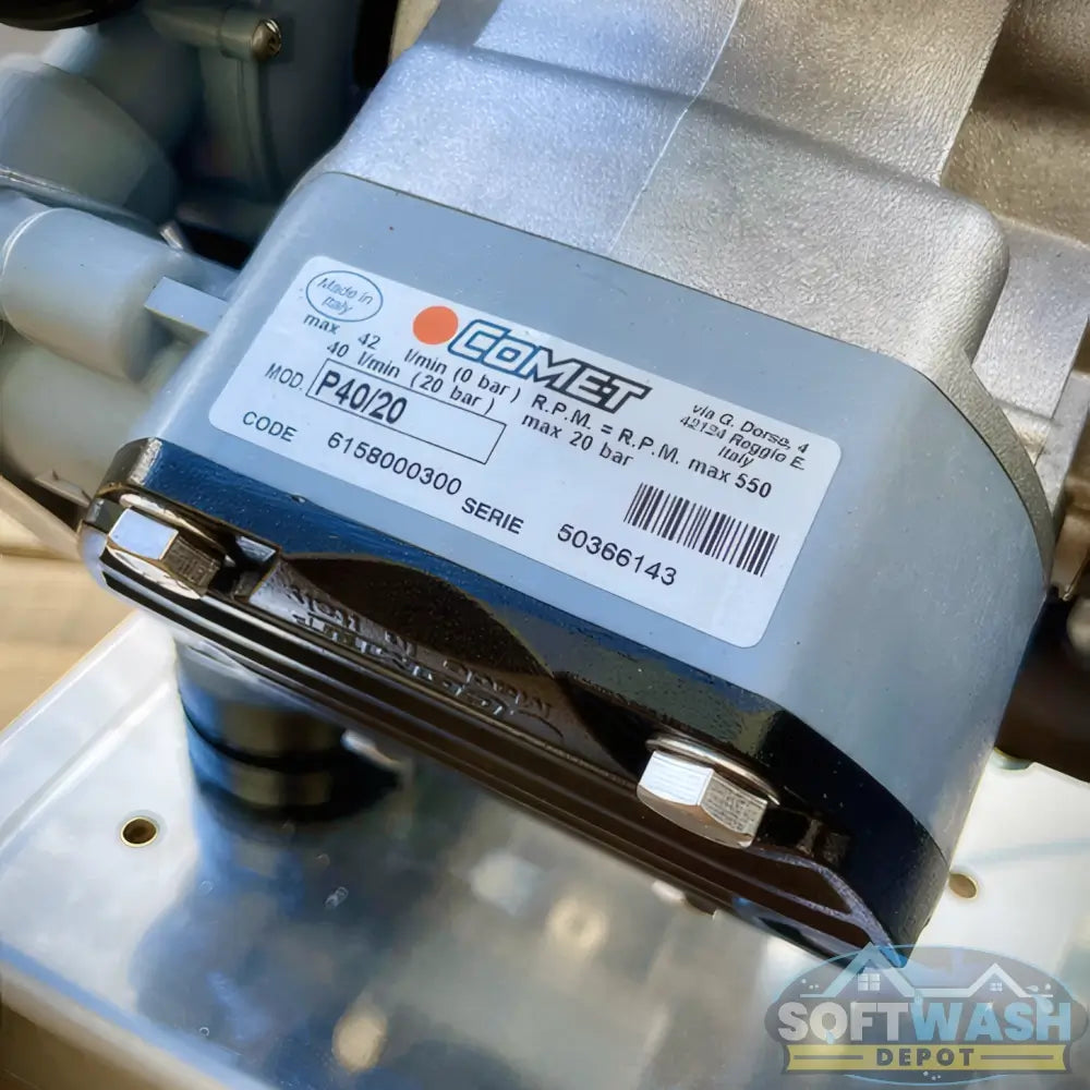 Honda engine with Comet P40 softwash pump system mounted on aluminum base, featuring battery cables and chemical-resistant components - Soft Wash Depot.