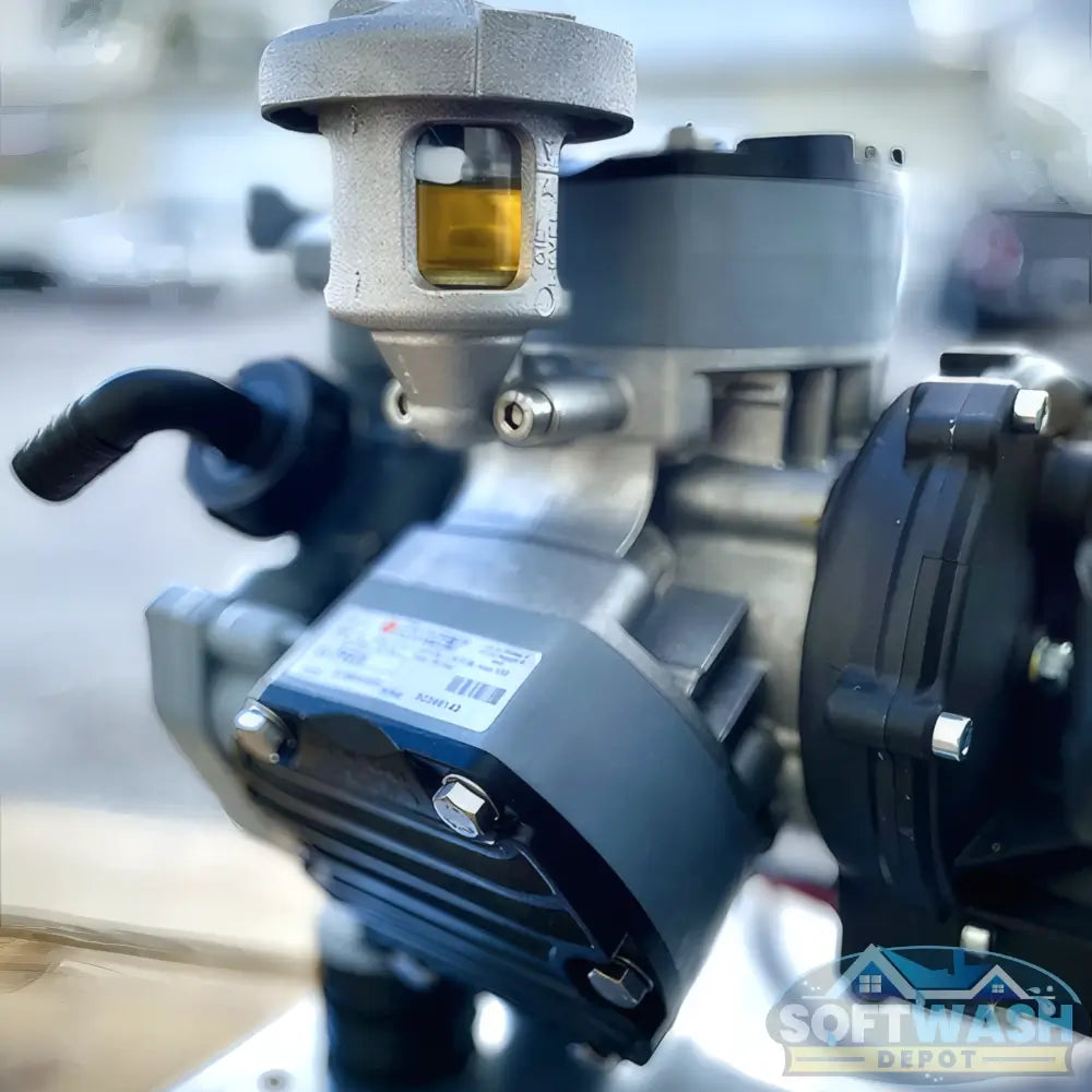 Honda engine with Comet P40 softwash pump system mounted on aluminum base, featuring battery cables and chemical-resistant components - Soft Wash Depot.