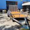 2026 Alcom 6x12 single axle aluminum trailer with rear drop-down tailgate and pressure-treated wood floor, designed for contractor and soft wash equipment setups. - Soft Wash Depot