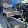 2026 Alcom 6x12 single axle aluminum trailer with rear drop-down tailgate and pressure-treated wood floor, designed for contractor and soft wash equipment setups. - Soft Wash Depot