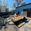 2026 Alcom 6x12 single axle aluminum trailer with rear drop-down tailgate and pressure-treated wood floor, designed for contractor and soft wash equipment setups. - Soft Wash Depot