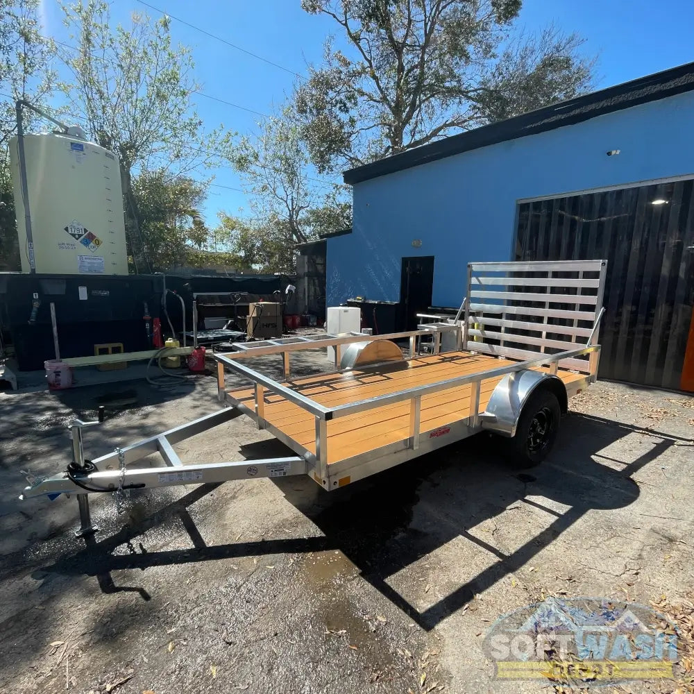 2026 Alcom 6x12 single axle aluminum trailer with rear drop-down tailgate and pressure-treated wood floor, designed for contractor and soft wash equipment setups. - Soft Wash Depot