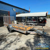 2026 Alcom 6x12 single axle aluminum trailer with rear drop-down tailgate and pressure-treated wood floor, designed for contractor and soft wash equipment setups. - Soft Wash Depot
